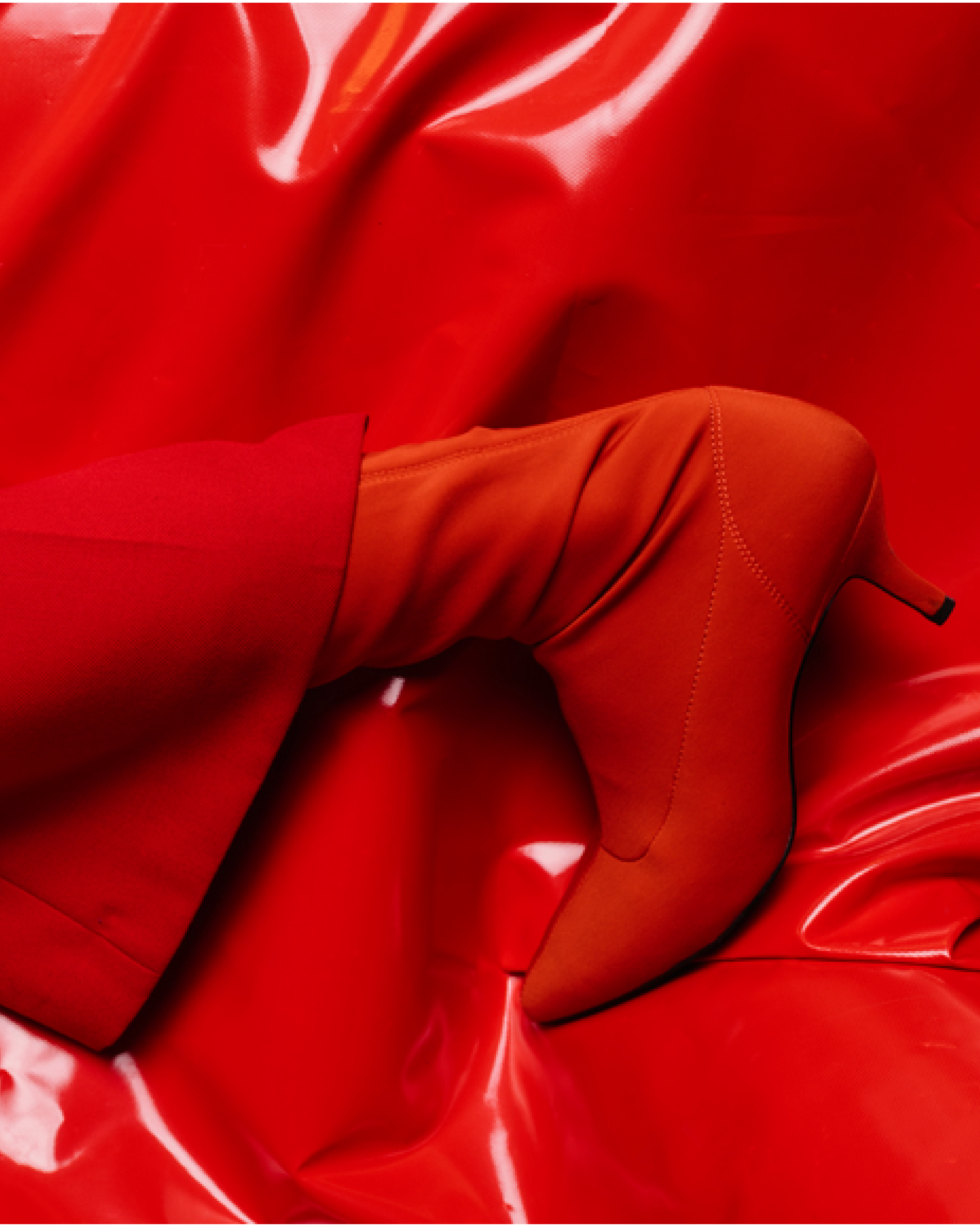 red boots on red shiny fabric - brand image for Feel You Creative brand design